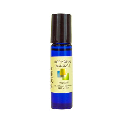 A cobalt blue roll-on bottle of Hormonal Balance using the best essential oils for a healthy reproductive system