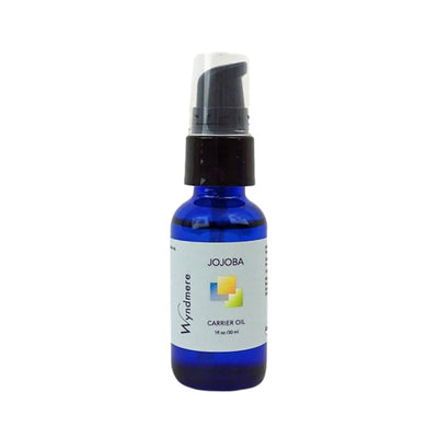 1oz cobalt blue bottle of Wyndmere Jojoba Oil with treatment pump