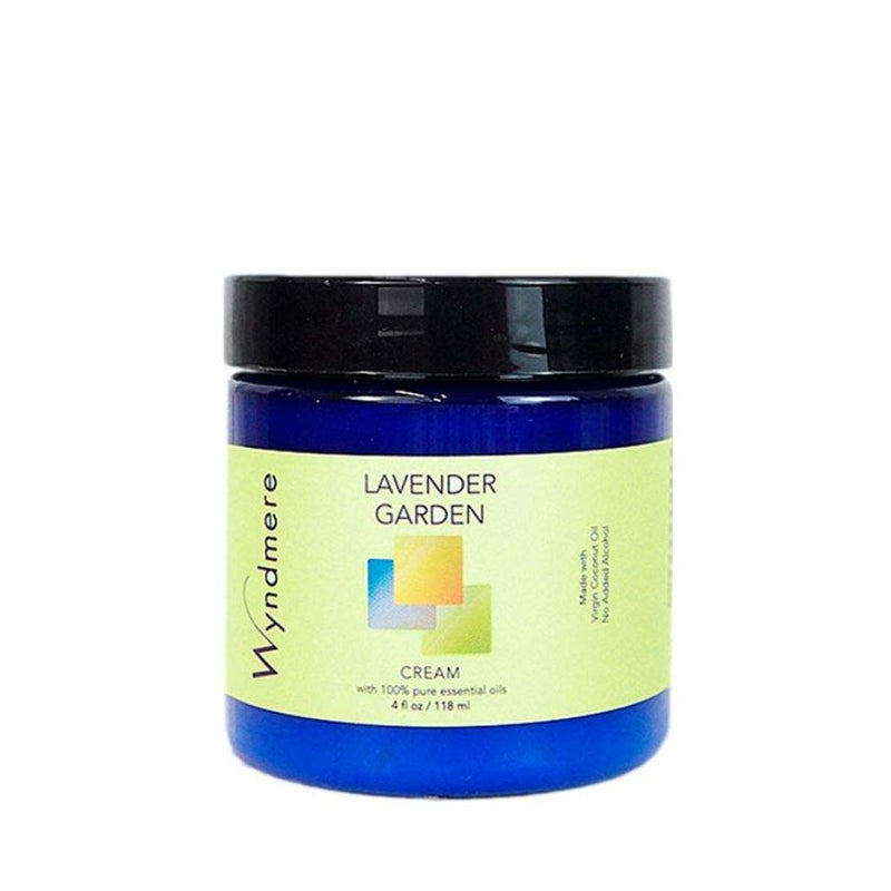 A 4oz cobalt blue jar of Wyndmere Lavender Garden moisturizing cream made with calming essential oils